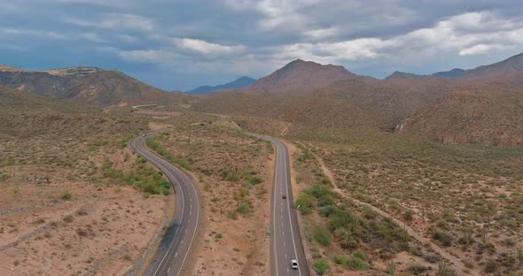 A Trip at High Speed Through the Arizona Desert to the Distant Mountains