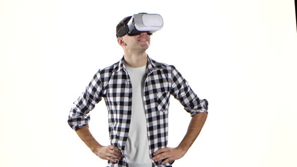 Man Carefully Considers What He Sees in Virtual Reality Glasses