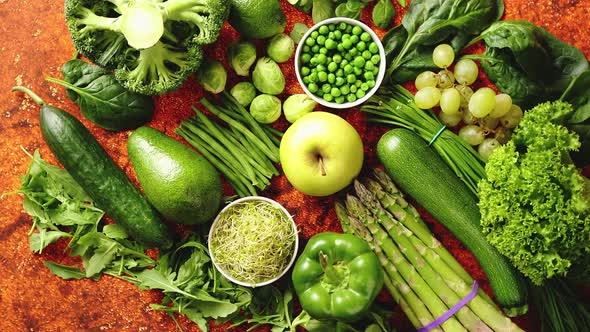 Fresh Green Vegetables and Fruits Assortment Placed on a Rusty Metal