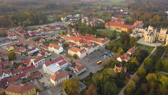 Aerial view of small town and green gardens in Lednice castle Chateau yard in Moravia, Czech