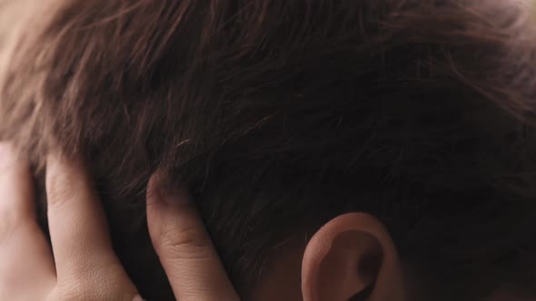 Loving Woman Cuddles Brown Hair of Boyfriend Closeup