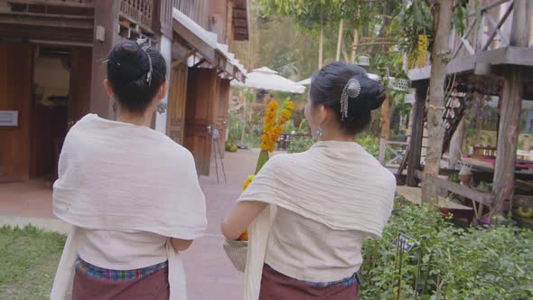 Back Of Two Girls In Thai Traditional Dress Walking