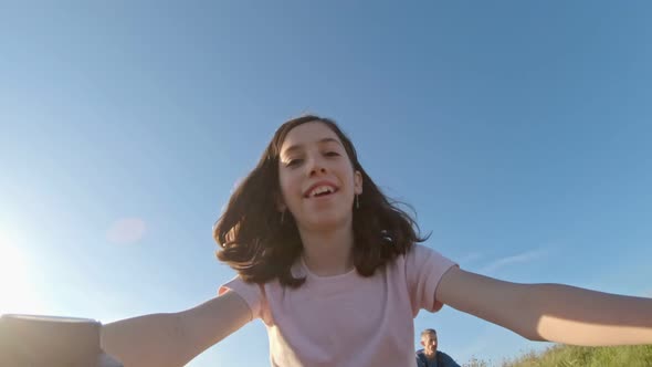 POV of a young girl enjoying a bicycle ride on the rural countryside