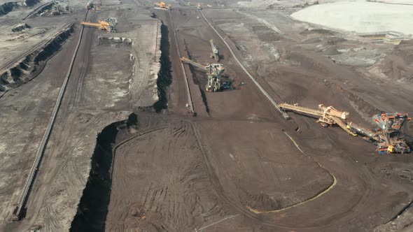 Flight Over the Quarry with Heavy Bucket Wheel Excavators Mining a Coal