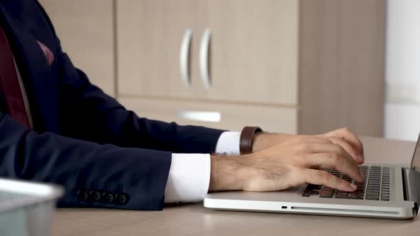 Businessman Hands in Close Up Typing on Computer Keyboard