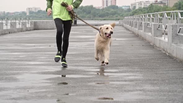 Teenage Boy and Cute Labrador on a Run