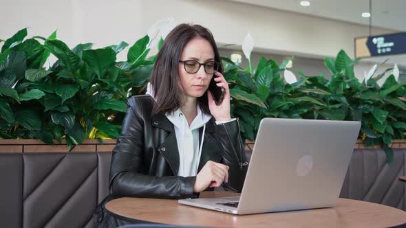 Young Professional Female Manager Using Laptop in Mall Businesswoman Working From Cafe Via Laptop