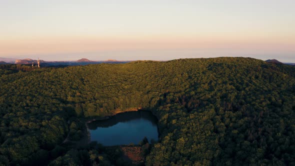 Aerial view mountain landscape with lake at sunset