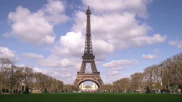 Eiffel tower with clouds in the background.