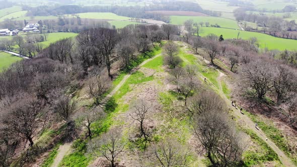 Aerial rising shot over Hembury Iron Age Fort in Devon England