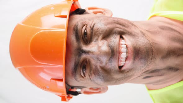 Portrait Mixed Race Guy with Dirty Face in Work Hard Hat Smiles Snowwhite Smile