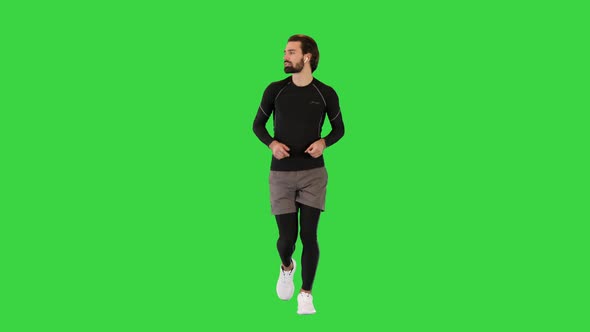 Runner Man In Sportswear Exercising Jogging on a Green Screen Chroma Key