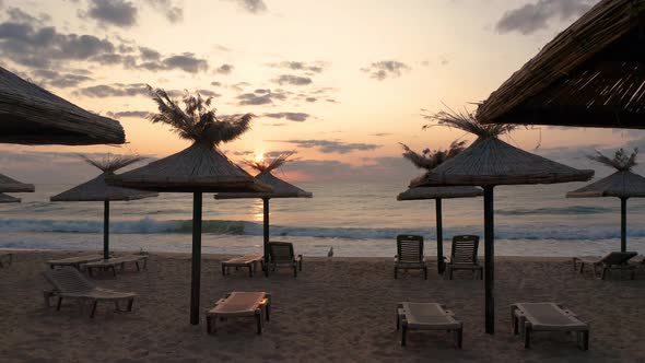 Empty sandy beach at sunrise