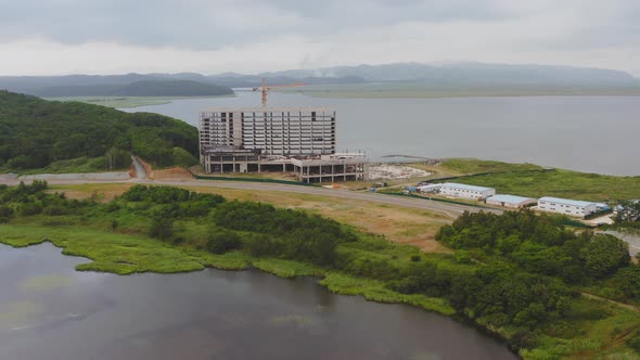 Drone View of an Unfinished Concrete Building on the Seashore