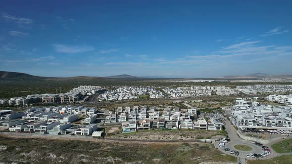 modern beach front home development in Big Bay, Cape Town, aerial