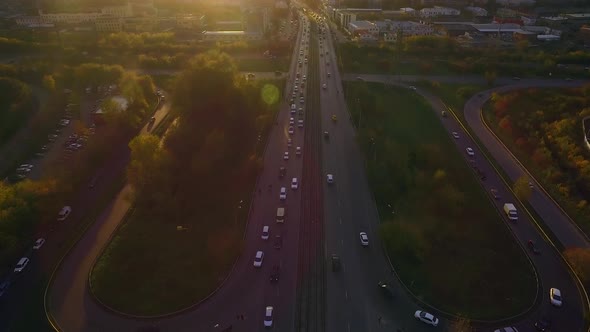 Aerial view of city traffic during rush hour at sunset