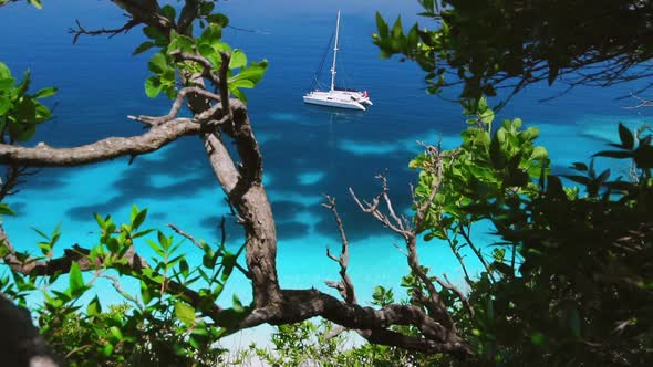 Video of White Yacht Sailing in the Turquoise Water. Amazing Water Colors and White Catamaran