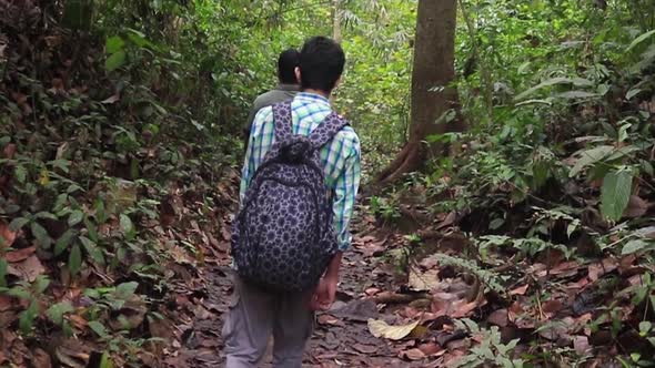 backpacker trekking in the nature reserve forest of Lawachara National Park, Sylhet, Bangladesh