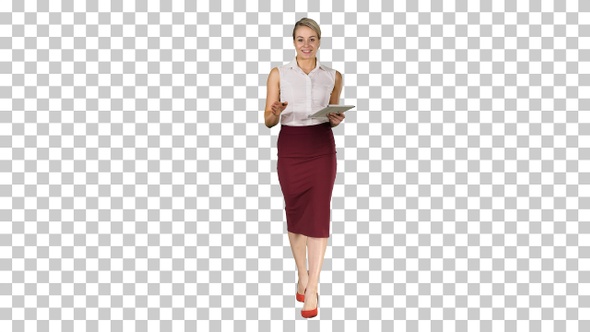 Business woman with tablet walking and talking to the camera