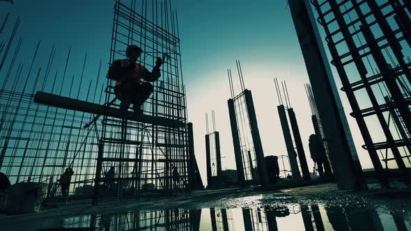 People Work on Construction Site, Fixing Carcass.