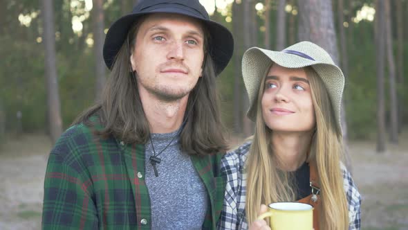 Portrait of Millennial Tourist Happy Couple in Plaid Hipster Shirts Hugging and Enjoing Travel