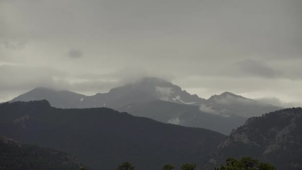 Time lapse of storm clouds over mountains