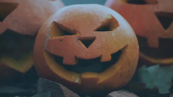 Halloween spooky pumpkins with scary carved faces