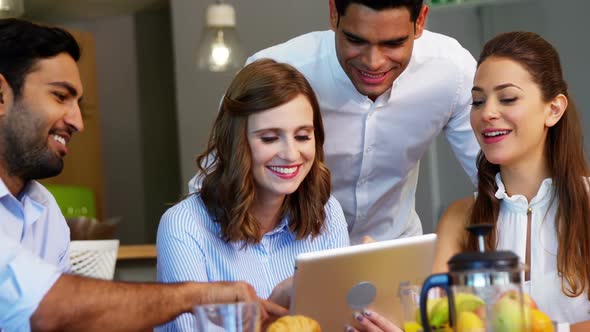 Executives using digital tablet