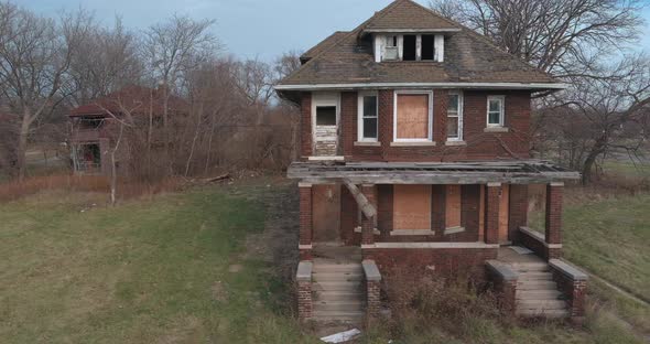 Drone view of dilapidated house in a Detroit neighborhood. This video was filmed in 4k for best imag