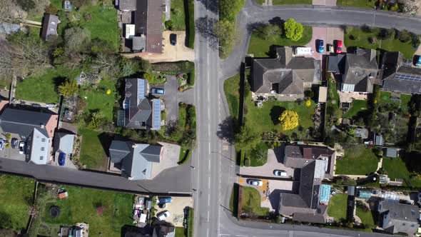 Top down aerial view housing estate and street in British rural town