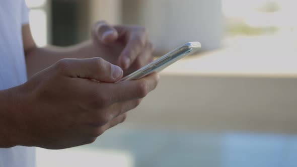 Cropped Shot of Man Using Modern Smartphone Outdoor