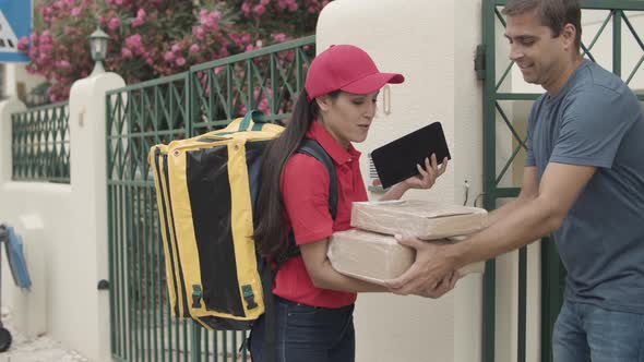 Courier Walking To Customers Door and Carrying Parcel