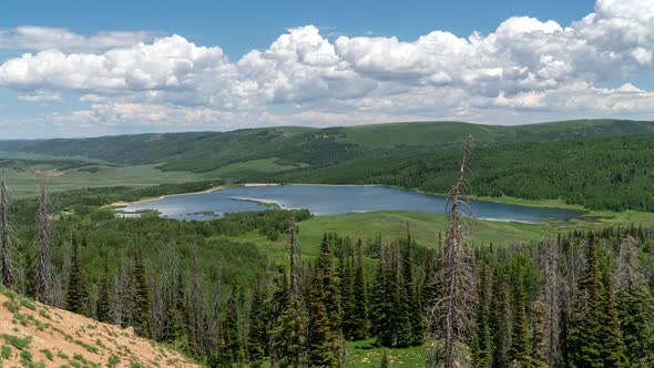 Time lapse of lakes in green mountain landscape in Utah