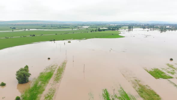 Aerial View River That Overflowed After Heavy Rains and Flooded Agricultural Fields