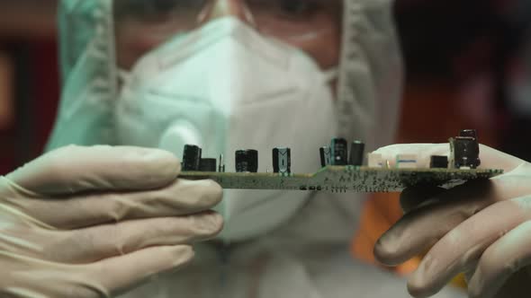 Man Holding Microchip Closeup