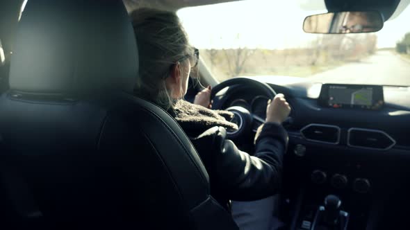 Woman Driver Car Travelling Steering Wheel. Tourism Driving On Country Road SUV. Tourist Lifestyle.