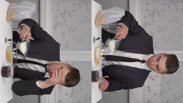 A Young Man in a Suit Eats Cereal and Drinks Coffee Sleepy and Cheerful