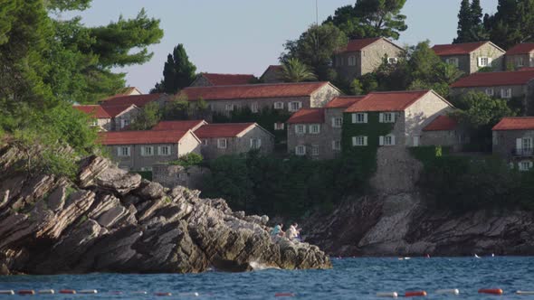 Houses with Red Tiled Roofs. Architecture of Sveti Stefan. Montenegro.