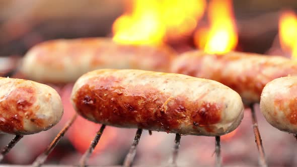 Juicy Sausages Cooked on the Grill with a Fire