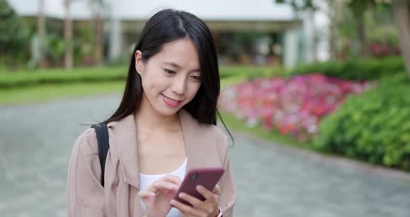 Woman use of cellphone at outdoor