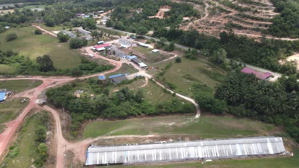 Aerial view of jungle, village, road and farms in Alor Gajah, Malacca