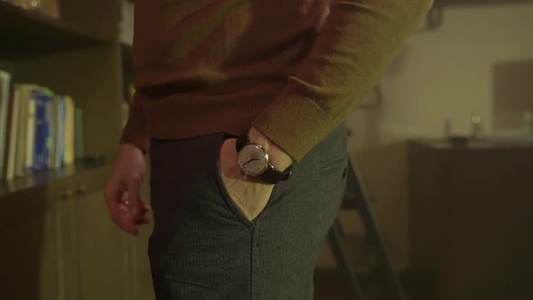 Man Puts Hand In Pants
