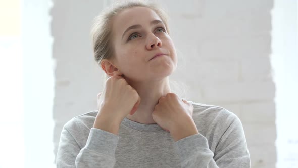 Pensive Young Woman Thinking and Working on Laptop