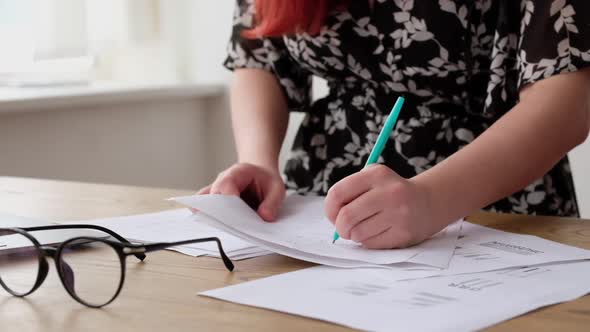 Young Girl Student is Writing Test Paper in Lesson at University or College