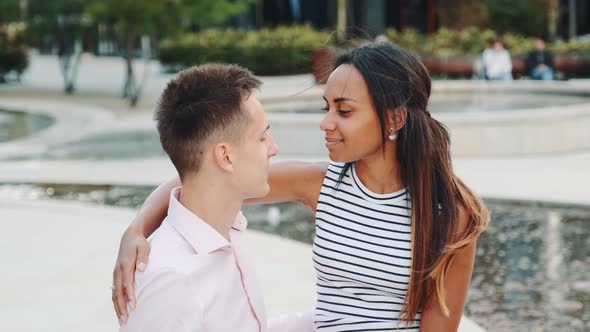 Handsome Man and Attractive Black Woman Having Date in a Modern City Park