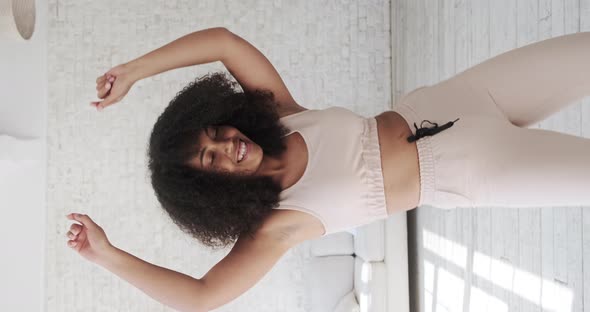 Trendy Happy Black Mixed Race Woman Vlogger Listeng Music Dances