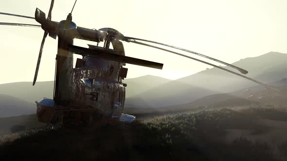 Old Rusted Military Helicopter in the Desert at Sunset