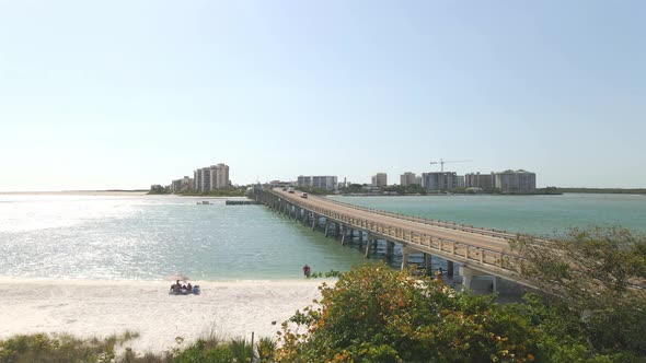 Aerial view over bridge in the ocean connecting Lovers key and fort Myers beach, Florida