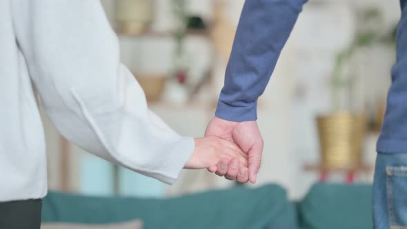 Close Up of Man Holding Hands of Woman