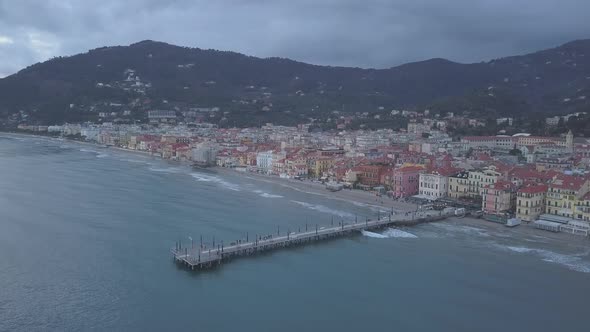 Alassio city and pier aerial view in Liguria, Italy. Mediterranean sea